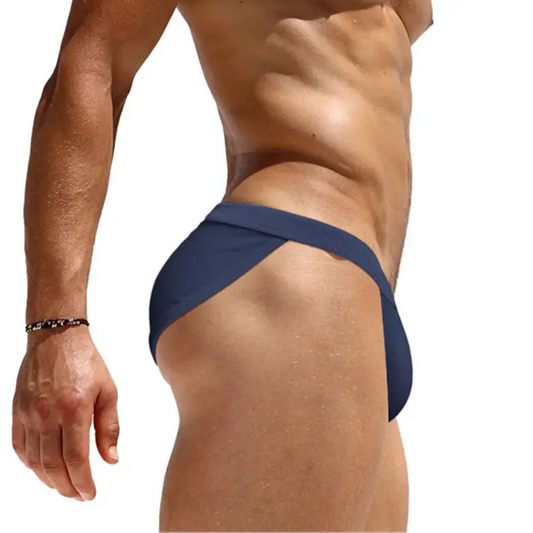 a sexy man in dark blue Men’s Clean Slate Swim Briefs - pridevoyageshop.com - gay men’s sexy swim briefs, trunks, board shorts, and bikinis