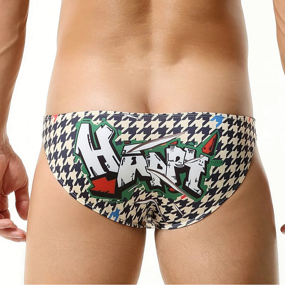 a sexy man in dark blue Men’s Go Faster Swim Briefs - pridevoyageshop.com - gay men’s sexy swim briefs, trunks, board shorts, and bikinis