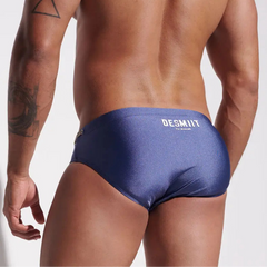a sexy man in dark blue Men’s Poolside Power Bottom Swim Briefs - pridevoyageshop.com - gay men’s sexy swim briefs, trunks, board shorts, and bikinis