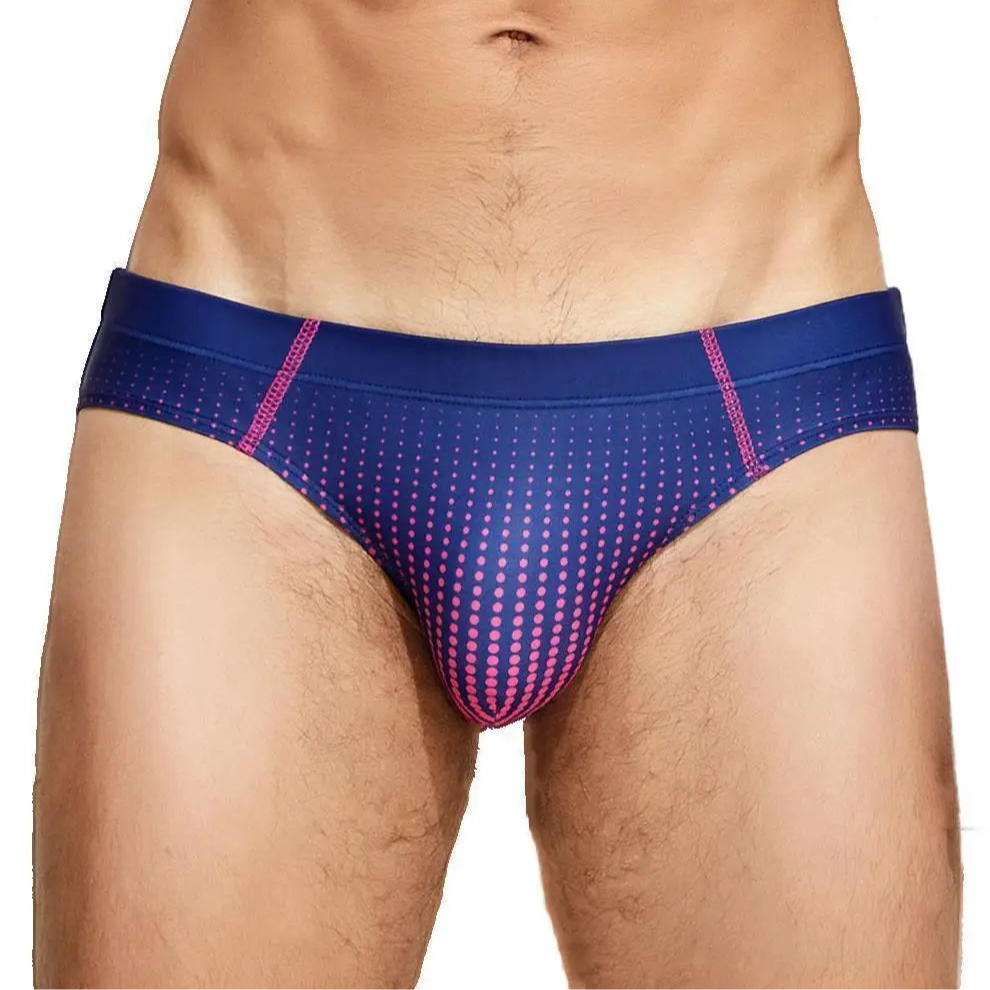a sexy man in dark blue Men’s Spank Me Dotty Swim Briefs - pridevoyageshop.com - gay men’s sexy swim briefs, trunks, board shorts, and bikinis