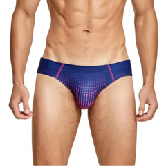 a sexy man in dark blue Men’s Spank Me Dotty Swim Briefs - pridevoyageshop.com - gay men’s sexy swim briefs, trunks, board shorts, and bikinis