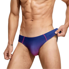 a sexy man in dark blue Men’s Spank Me Dotty Swim Briefs - pridevoyageshop.com - gay men’s sexy swim briefs, trunks, board shorts, and bikinis
