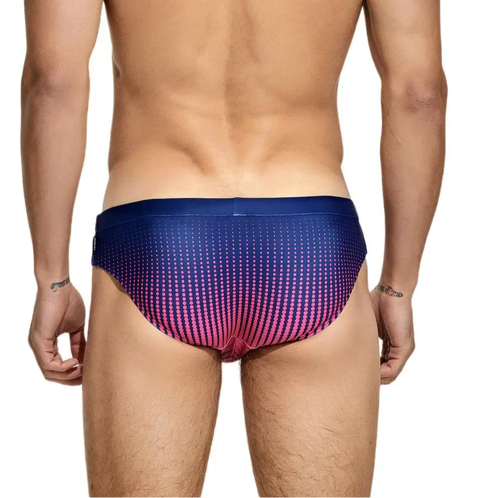 a sexy man in dark blue Men’s Spank Me Dotty Swim Briefs - pridevoyageshop.com - gay men’s sexy swim briefs, trunks, board shorts, and bikinis