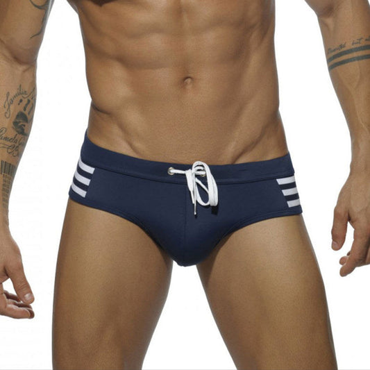 a sexy man in dark blue Men’s Striped Stallion Low Rise Swim Briefs - pridevoyageshop.com - gay men’s sexy swim briefs, trunks, board shorts, and bikinis