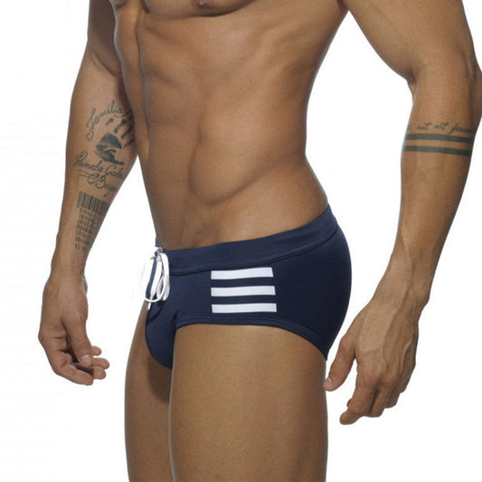 a sexy man in dark blue Men’s Striped Stallion Low Rise Swim Briefs - pridevoyageshop.com - gay men’s sexy swim briefs, trunks, board shorts, and bikinis