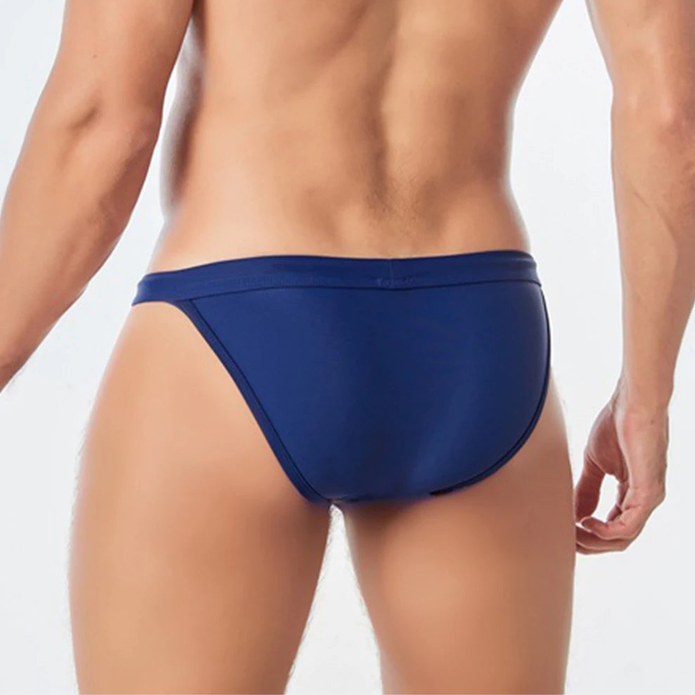 a sexy man in dark blue Men’s Wet Package Micro Swim Briefs - pridevoyageshop.com - gay men’s sexy swim briefs, trunks, board shorts, and bikinis