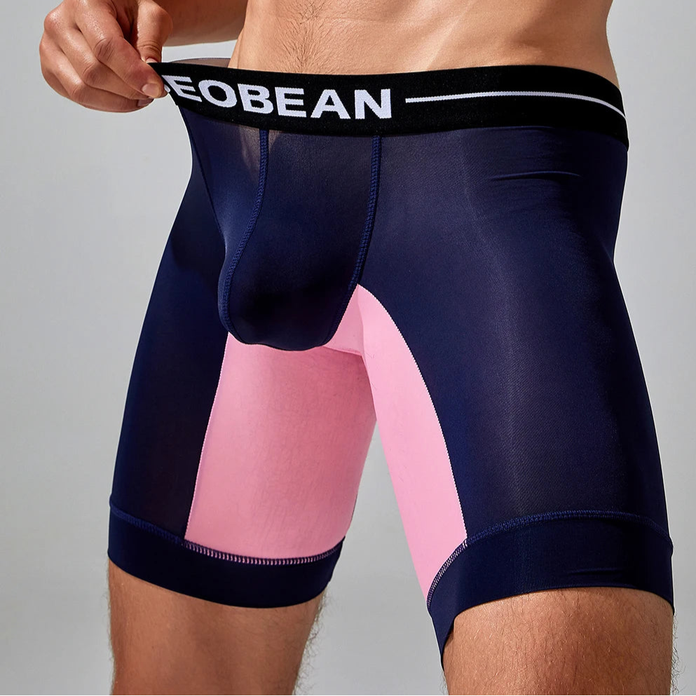 a sexy man in dark blue SEOBEAN Men’s Dominion Long Sheer Boxer Briefs – pridevoyageshop.com – gay men’s sexy swim briefs, trunks, board shorts, and bikinis