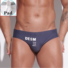 a sexy man in dark gray Men’s MVP Meatpack Swim Briefs with pad - pridevoyageshop.com - gay men’s sexy swim briefs, trunks, board shorts, and bikinis