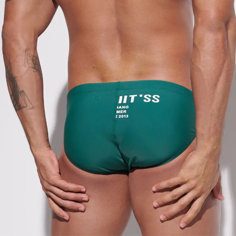 a sexy man in dark green Men’s MVP Meatpack Swim Briefs - pridevoyageshop.com - gay men’s sexy swim briefs, trunks, board shorts, and bikinis