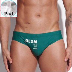 a sexy man in dark green Men’s MVP Meatpack Swim Briefs with pad - pridevoyageshop.com - gay men’s sexy swim briefs, trunks, board shorts, and bikinis