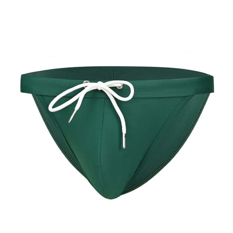 a sexy man in dark green Men’s Show Pony Drawstring Swim Briefs - pridevoyageshop.com - gay men’s sexy swim briefs, trunks, board shorts, and bikinis