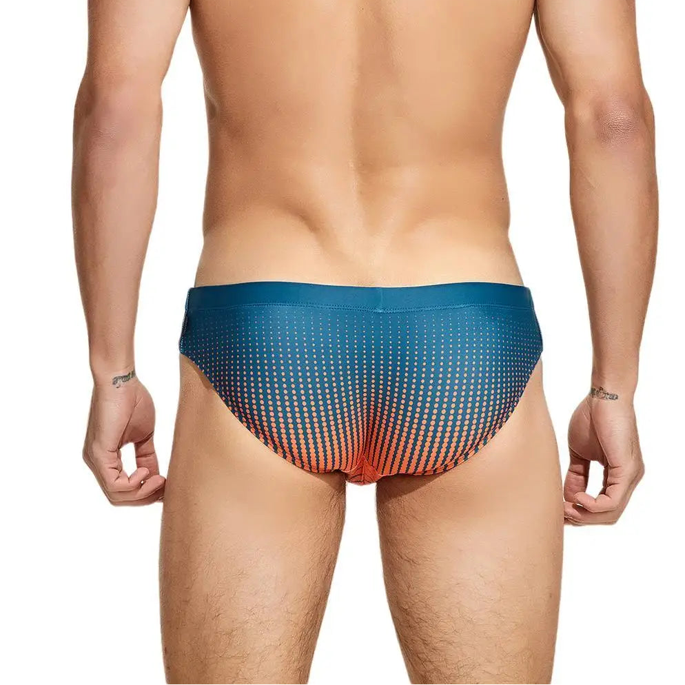 a sexy man in dark green Men’s Spank Me Dotty Swim Briefs - pridevoyageshop.com - gay men’s sexy swim briefs, trunks, board shorts, and bikinis