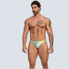 a sexy man in dark sea green Men’s Ultra-Slick Wet Werk Mini Swim Briefs - pridevoyageshop.com - gay men’s sexy swim briefs, trunks, board shorts, and bikinis