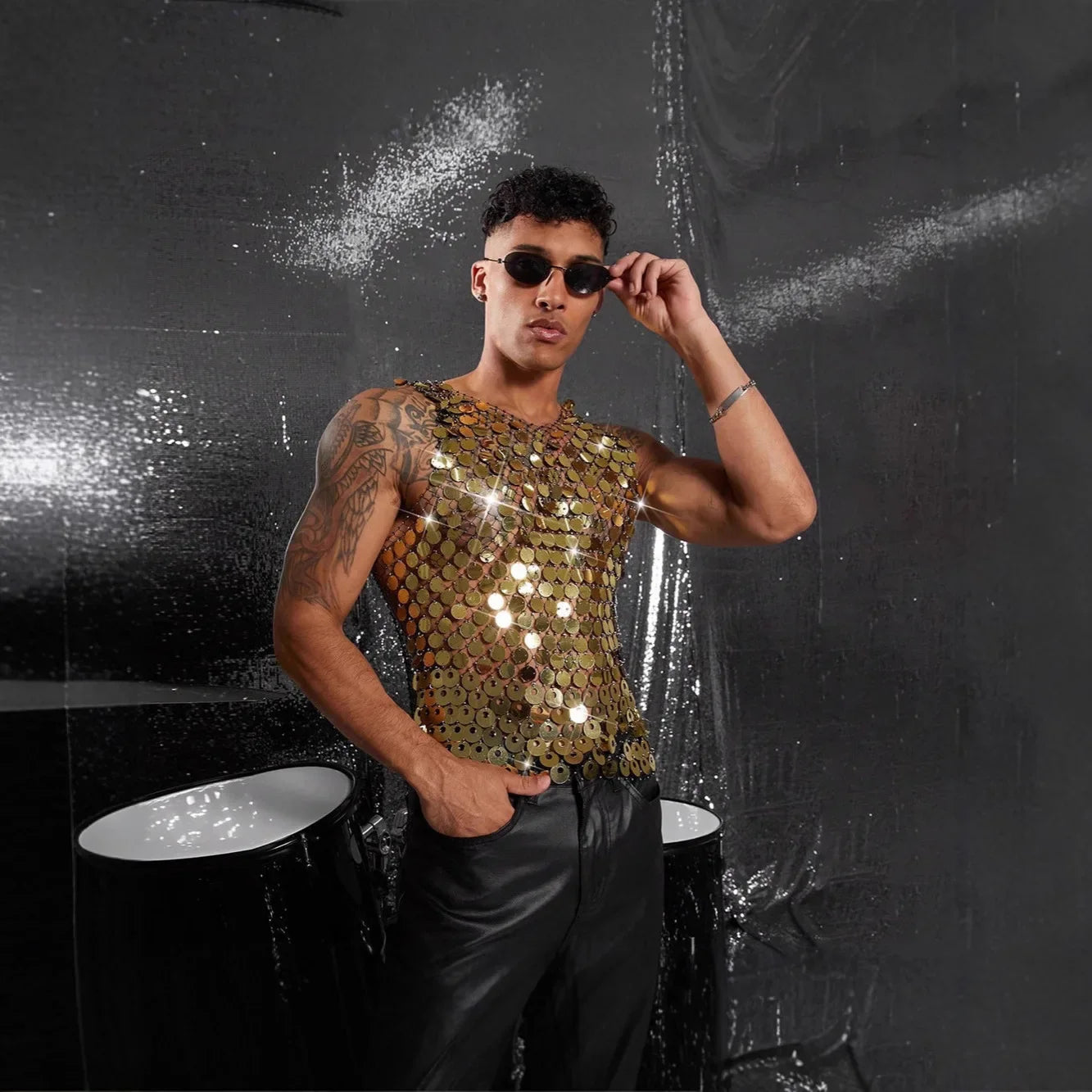 a sexy man in gold Diva’s Armor Sequin Vest - pridevoyageshop.com - gay men’s harness, lingerie and fetish wear