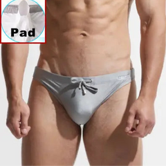 a sexy man in gray Desmiit Men’s After Hours Aquatics Briefs with pad - pridevoyageshop.com - gay men’s sexy swim briefs, trunks, board shorts, and bikinis