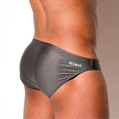 a sexy man in gray Desmiit Men’s Trophy Cut Swim Briefs - pridevoyageshop.com - gay men’s sexy swim briefs, trunks, board shorts, and bikinis