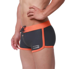 a sexy man in gray Men’s Circuit Beat Low Rise Swim Trunks - pridevoyageshop.com - gay men’s sexy swim briefs, trunks, board shorts, and bikinis