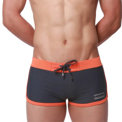 a sexy man in gray Men’s Circuit Beat Low Rise Swim Trunks - pridevoyageshop.com - gay men’s sexy swim briefs, trunks, board shorts, and bikinis