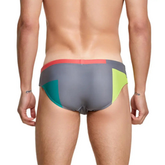 a sexy man in gray Men’s Colorblock Bait Swim Briefs - pridevoyageshop.com - gay men’s sexy swim briefs, trunks, board shorts, and bikinis