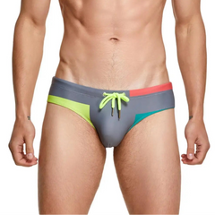 a sexy man in gray Men’s Colorblock Bait Swim Briefs - pridevoyageshop.com - gay men’s sexy swim briefs, trunks, board shorts, and bikinis