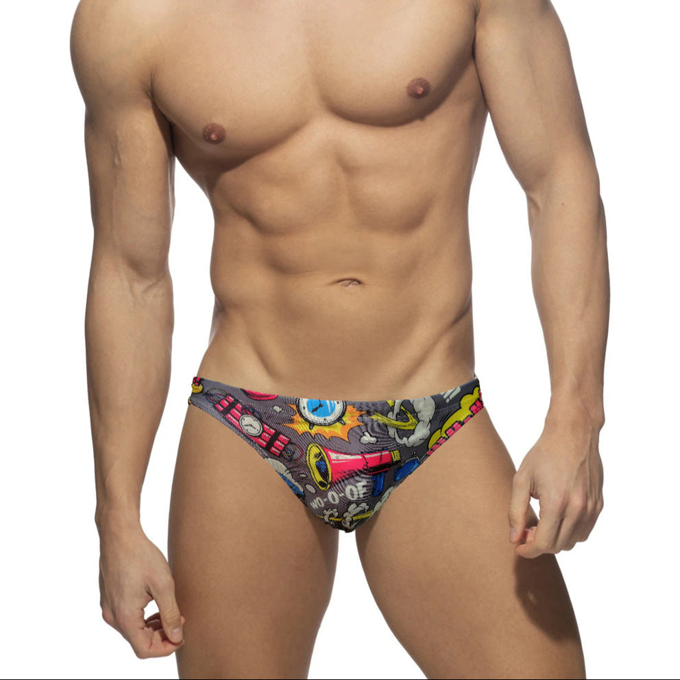 a sexy man in gray Men’s Comic Crotch Swim Briefs - pridevoyageshop.com - gay men’s sexy swim briefs, trunks, board shorts, and bikinis