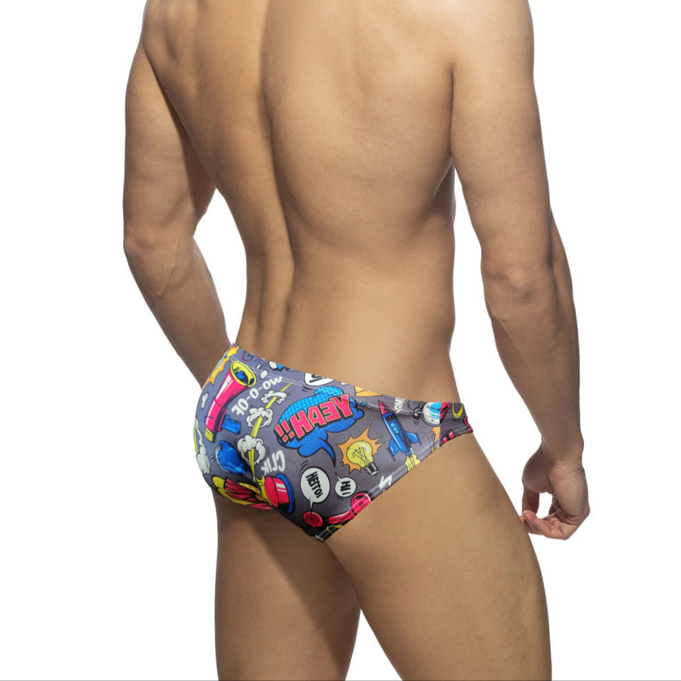 a sexy man in gray Men’s Comic Crotch Swim Briefs - pridevoyageshop.com - gay men’s sexy swim briefs, trunks, board shorts, and bikinis