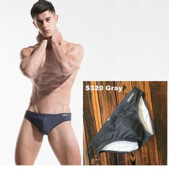 a sexy man in gray Men’s Pool Plumper Padded Swim Briefs - pridevoyageshop.com - gay men’s sexy swim briefs, trunks, board shorts, and bikinis