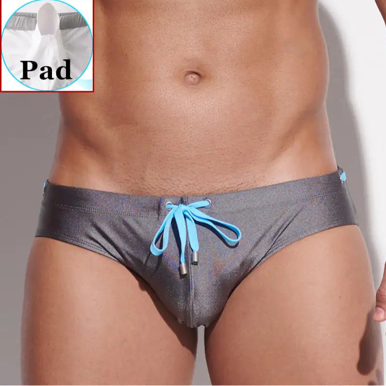 a sexy man in gray Men’s Poolside Power Bottom Swim Briefs with pad - pridevoyageshop.com - gay men’s sexy swim briefs, trunks, board shorts, and bikinis