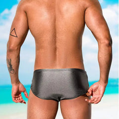 a sexy man in gray Men’s Pouch Devil Low Rise Swim Briefs - pridevoyageshop.com - gay men’s sexy swim briefs, trunks, board shorts, and bikinis