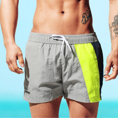 a sexy man in gray Men’s Signal Swim Beach Board Shorts – pridevoyageshop.com – gay men’s sexy swim briefs, trunks, board shorts, and bikinis