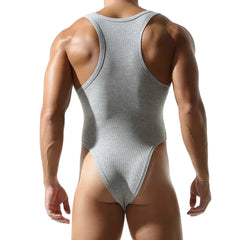a sexy man in gray Submission Rib Thong Bodysuit – pridevoyageshop.com – gay men’s harness, lingerie and fetish wear