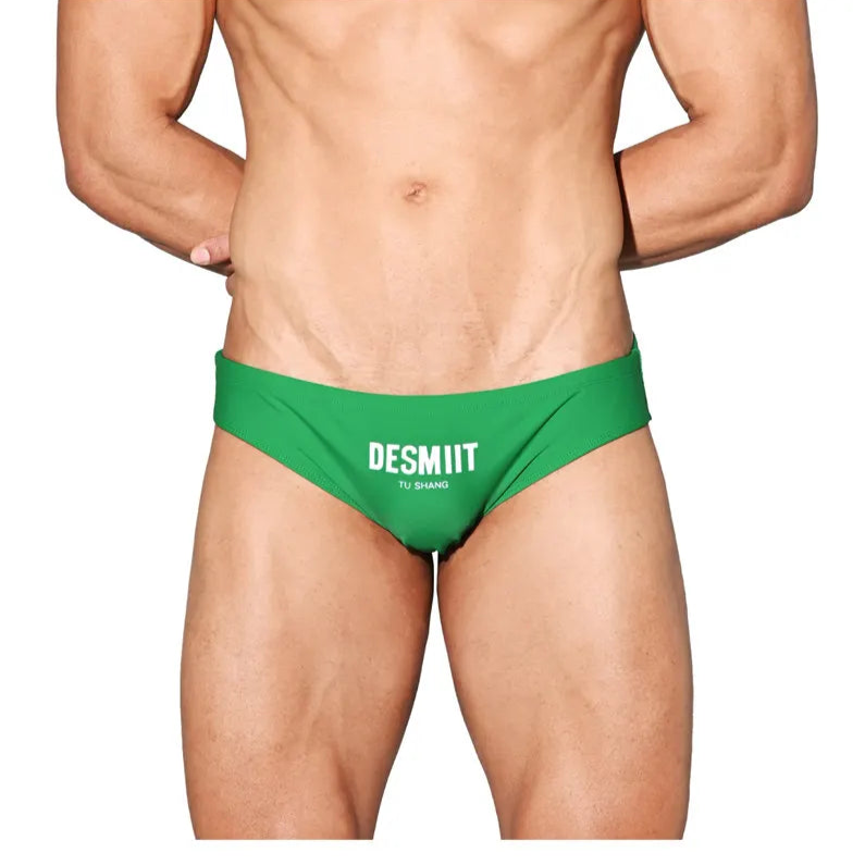 a sexy man in green Desmiit Men’s Brunch-Ready Bikini Swim Briefs - pridevoyageshop.com - gay men’s sexy swim briefs, trunks, board shorts, and bikinis