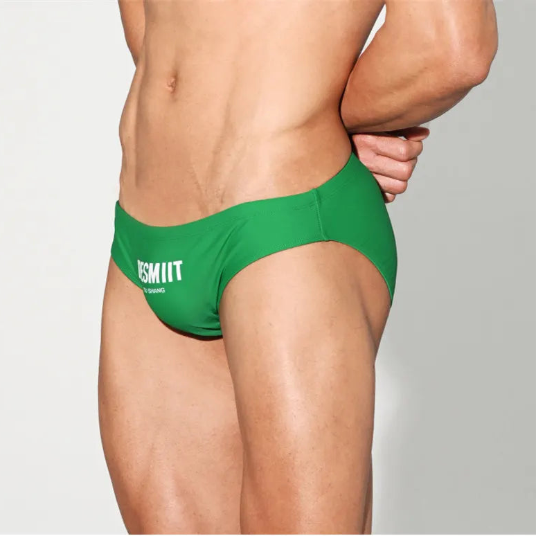 a sexy man in green Desmiit Men’s Brunch-Ready Bikini Swim Briefs - pridevoyageshop.com - gay men’s sexy swim briefs, trunks, board shorts, and bikinis