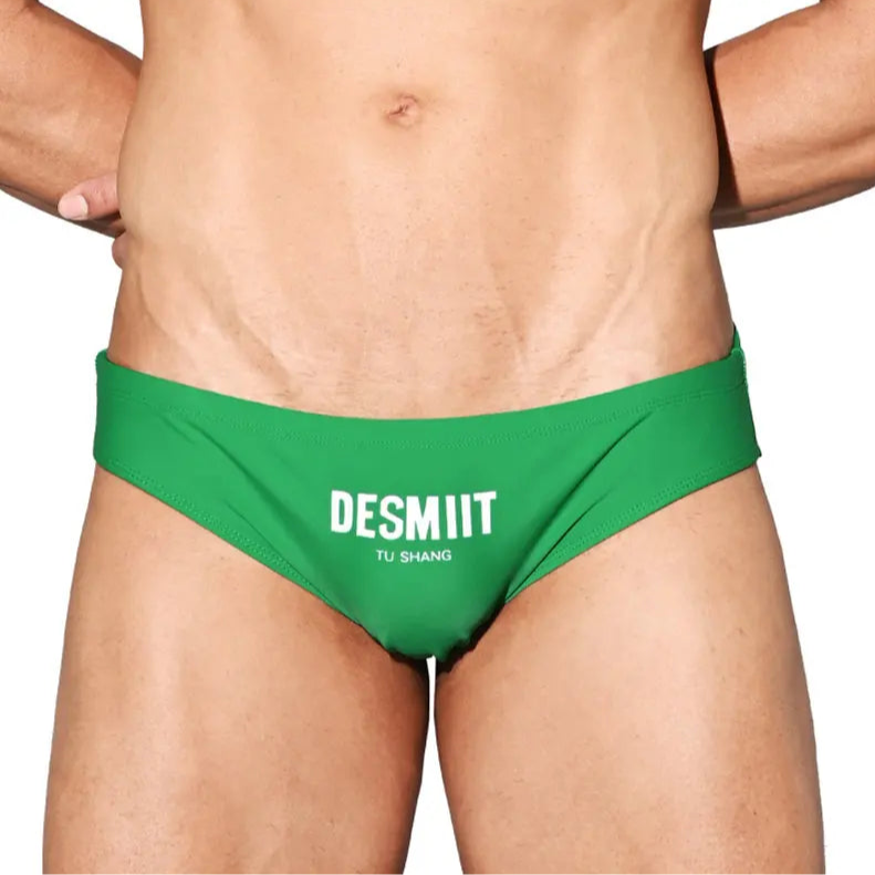 a sexy man in green Desmiit Men’s Brunch-Ready Bikini Swim Briefs - pridevoyageshop.com - gay men’s sexy swim briefs, trunks, board shorts, and bikinis
