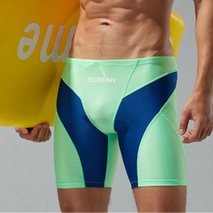 a sexy man in green Men’s Iron Vortex Compression Swim Shorts – pridevoyageshop.com – gay men’s sexy swim briefs, trunks, board shorts, and bikinis