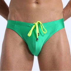 a sexy man in green Men's Killer Bulge Swim Brief - pridevoyageshop.com - gay men’s sexy swim briefs, trunks, board shorts, and bikinis