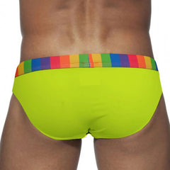 a sexy man in green Men’s Pride Patrol Rainbow Band Swim Briefs - pridevoyageshop.com - gay men’s sexy swim briefs, trunks, board shorts, and bikinis