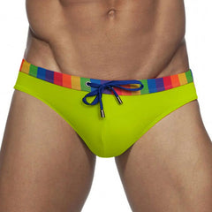 a sexy man in green Men’s Pride Patrol Rainbow Band Swim Briefs - pridevoyageshop.com - gay men’s sexy swim briefs, trunks, board shorts, and bikinis