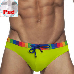 a sexy man in green Men’s Pride Patrol Rainbow Band Swim Briefs with pad - pridevoyageshop.com - gay men’s sexy swim briefs, trunks, board shorts, and bikinis