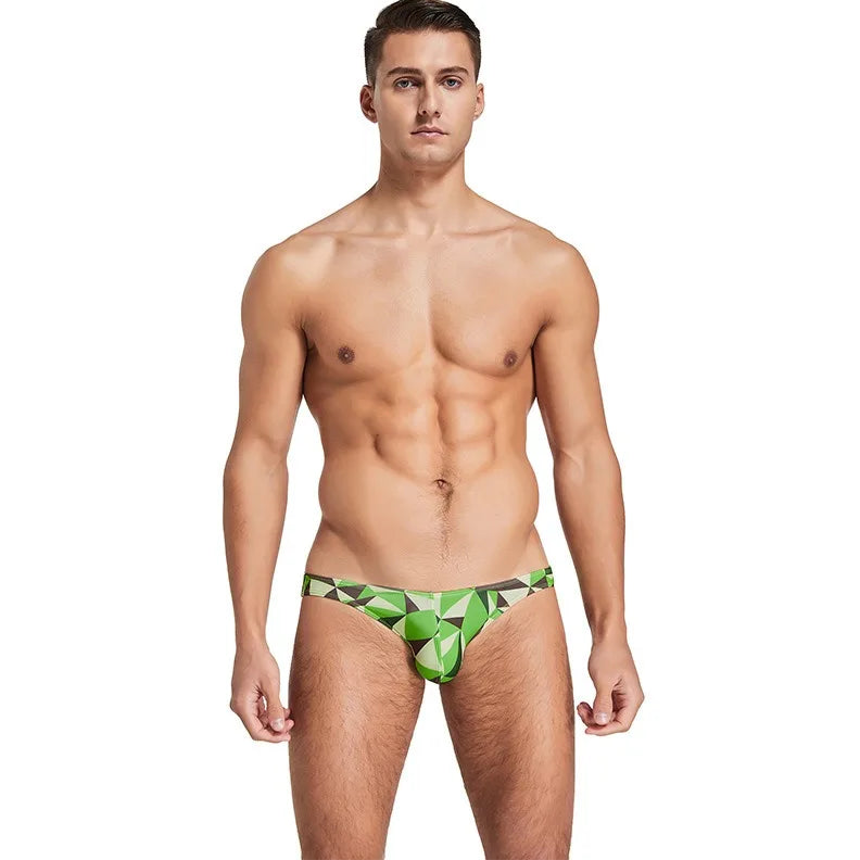 a sexy man in green Men’s Prism Tease Swim Briefs - pridevoyageshop.com - gay men’s sexy swim briefs, trunks, board shorts, and bikinis