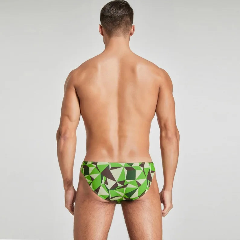 a sexy man in green Men’s Prism Tease Swim Briefs - pridevoyageshop.com - gay men’s sexy swim briefs, trunks, board shorts, and bikinis