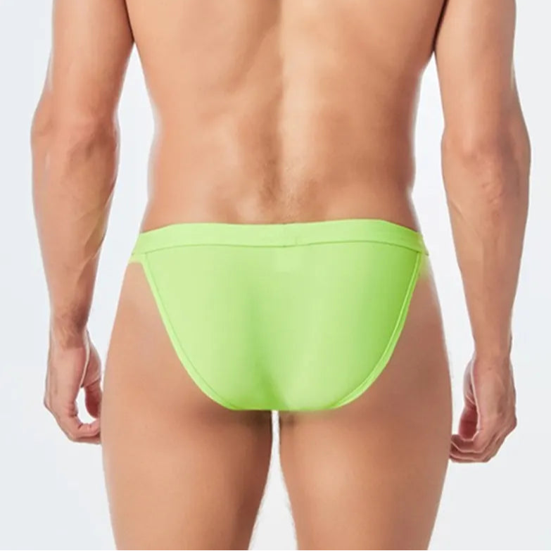 a sexy man in green Men’s Thigh High Rider Swim Briefs - pridevoyageshop.com - gay men’s sexy swim briefs, trunks, board shorts, and bikinis