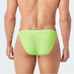 a sexy man in green Men’s Thigh High Rider Swim Briefs - pridevoyageshop.com - gay men’s sexy swim briefs, trunks, board shorts, and bikinis