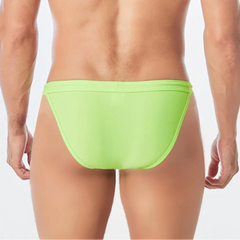 a sexy man in green Men’s Wet Package Micro Swim Briefs - pridevoyageshop.com - gay men’s sexy swim briefs, trunks, board shorts, and bikinis