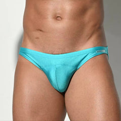 a sexy man in light blue Desmiit Men’s Heatseeker Micro Swim Briefs - pridevoyageshop.com - gay men’s sexy swim briefs, trunks, board shorts, and bikinis