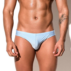 a sexy man in light blue Desmiit Men’s Trophy Cut Swim Briefs - pridevoyageshop.com - gay men’s sexy swim briefs, trunks, board shorts, and bikinis