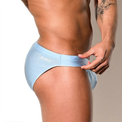 a sexy man in light blue Desmiit Men’s Trophy Cut Swim Briefs - pridevoyageshop.com - gay men’s sexy swim briefs, trunks, board shorts, and bikinis