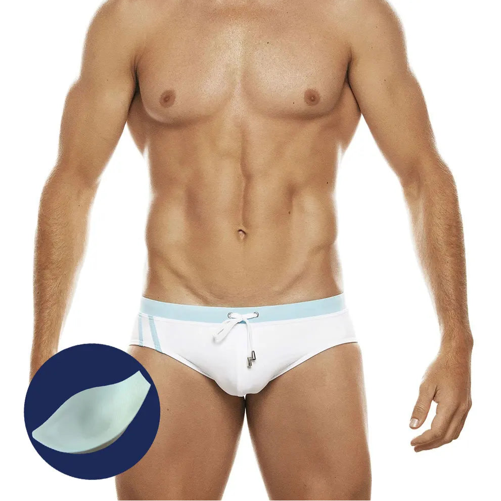 a sexy man in light blue Men’s Clean Line Hookup Swim Briefs with pad - pridevoyageshop.com - gay men’s sexy swim briefs, trunks, board shorts, and bikinis