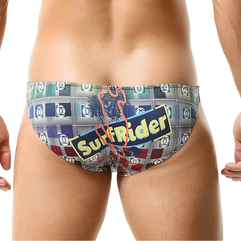 a sexy man in light gray Men’s Go Faster Swim Briefs - pridevoyageshop.com - gay men’s sexy swim briefs, trunks, board shorts, and bikinis