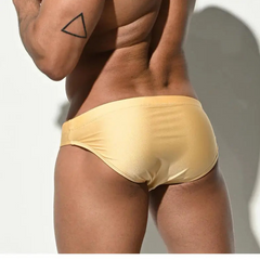 a sexy man in light yellow Men’s Pool Plumper Padded Swim Briefs - pridevoyageshop.com - gay men’s sexy swim briefs, trunks, board shorts, and bikinis